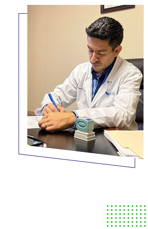 Chiropractor Kissimmee FL Juan Escobar Signing Documents HP Dr. Juan Escobar filling out paperwork in his office