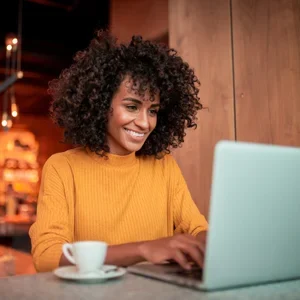 A woman using her laptop to find chiropractic care